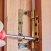 Door Hinge Being Screwed In
